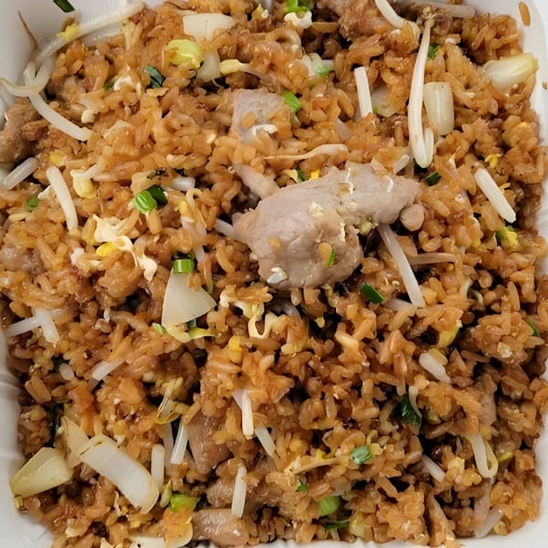 Close-up of Weng's Kitchen's pork fried rice with bean sprouts, egg, and green onions.